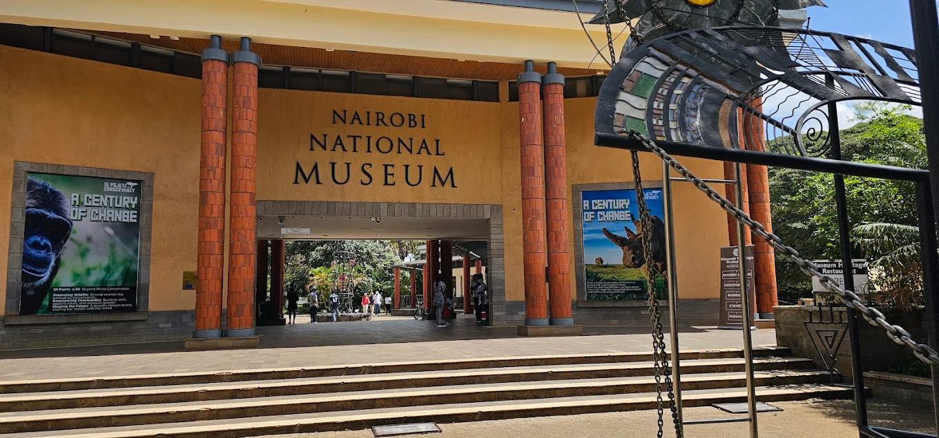 Exterior view of the Nairobi National Museum at Museum Hill, showcasing its iconic architecture and lush gardens.