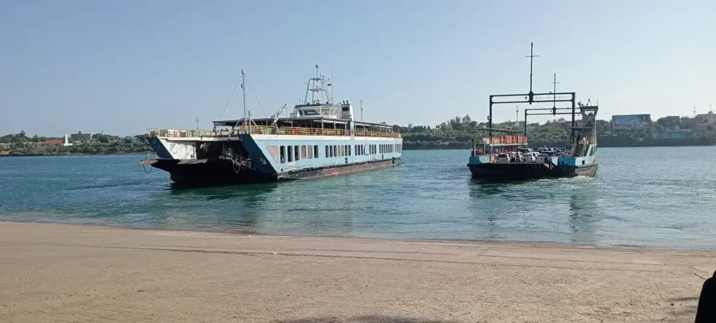 Crowded Likoni Ferry transporting vehicles and passengers across the deep Kilindini Harbour channel in Mombasa.