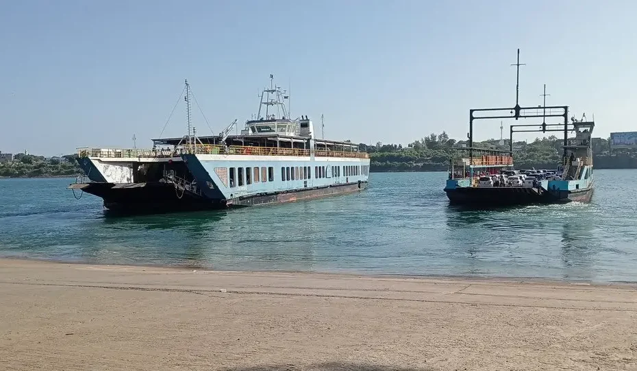 Crowded Likoni Ferry transporting vehicles and passengers across the deep Kilindini Harbour channel in Mombasa.