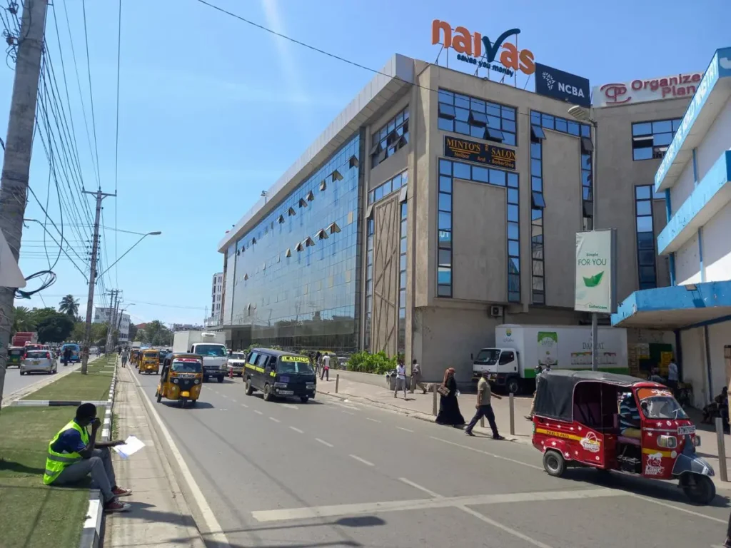 Street view of the Mwembe Tayari area in Mombasa near Naivas Supermarket and major bus terminals.