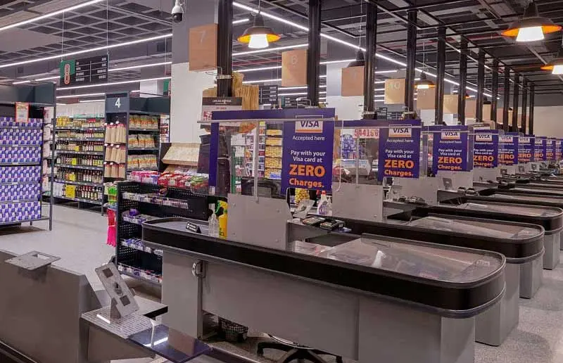 Seamless M-Pesa mobile money payment at the Naivas Mwembe Tayari checkout counters.