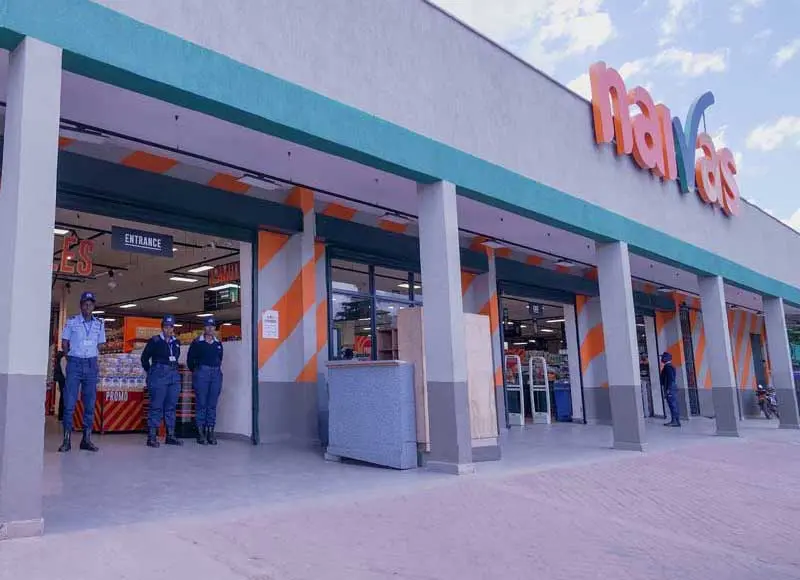 Secure entrance and parking area at Naivas Mwembe Tayari Mombasa for 24/7 shoppers.